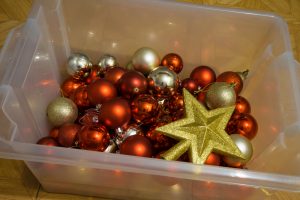 christmas decorations stored in a clear box